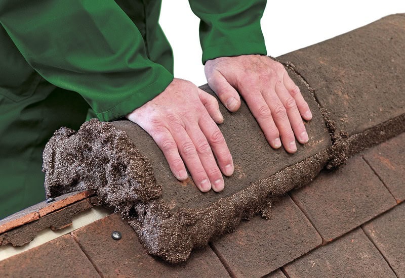 Pressing a ridge tile into Flexim Roof Mortar for a quick weather tight installation