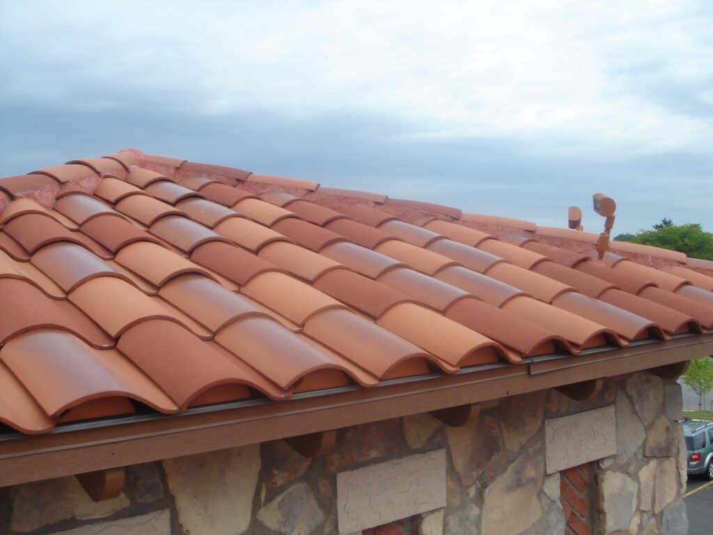 Looking up at Terra Cotta Flexim Hips on a Pan & Cover Roof