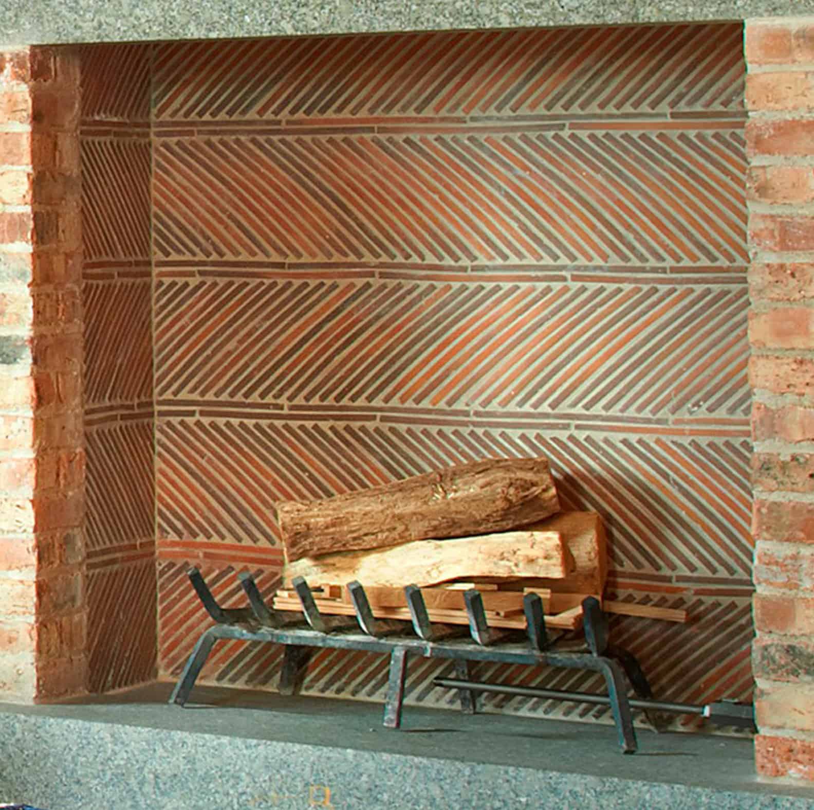 Fireplace with herringbone pattern using clay roof tiles. Designed by Liederbach & Graham Architects