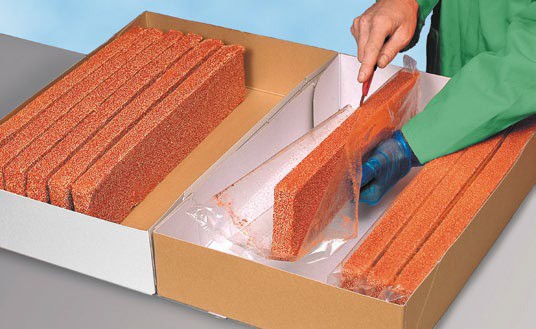 Cutting Open A Stick Of Flexim Roof Mortar
