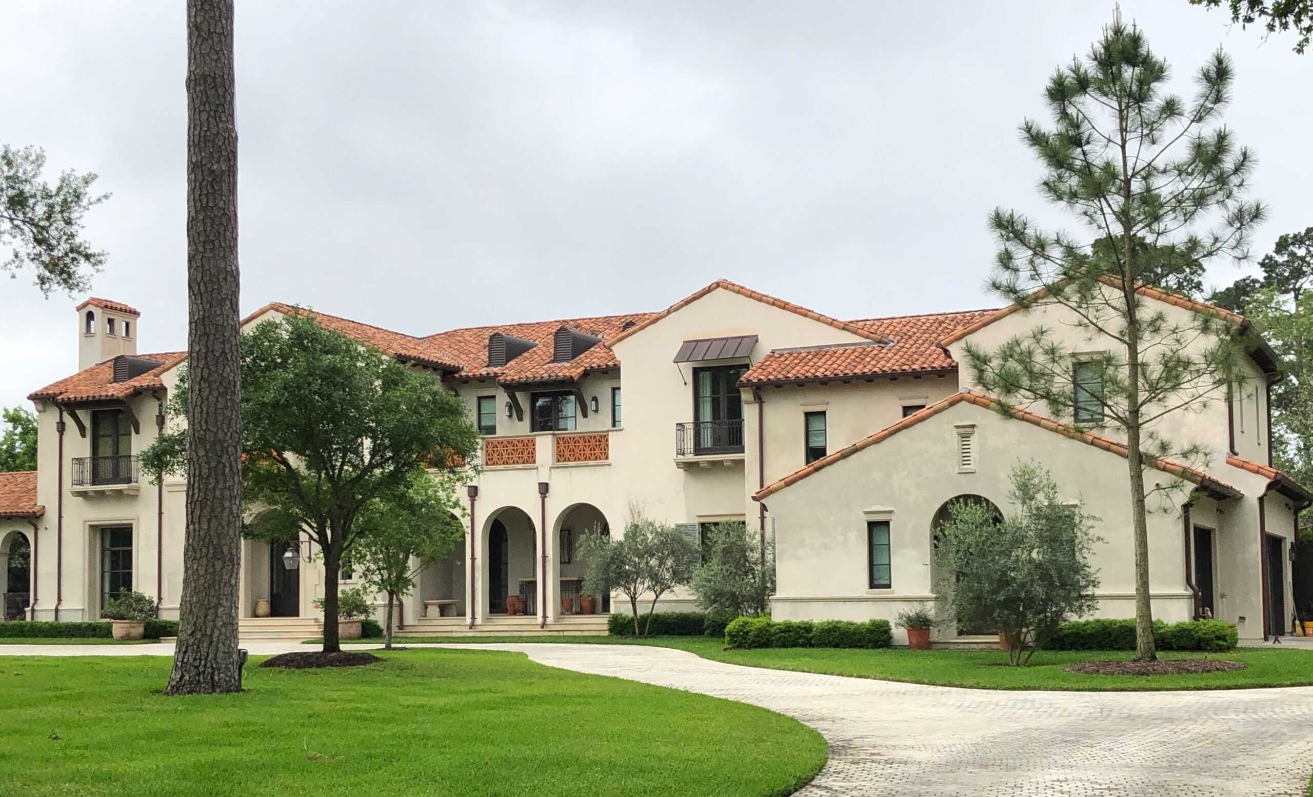 This courtyard roof blends perfectly with the stucco finish. Castilla Clay Tiles in Sunset Blend