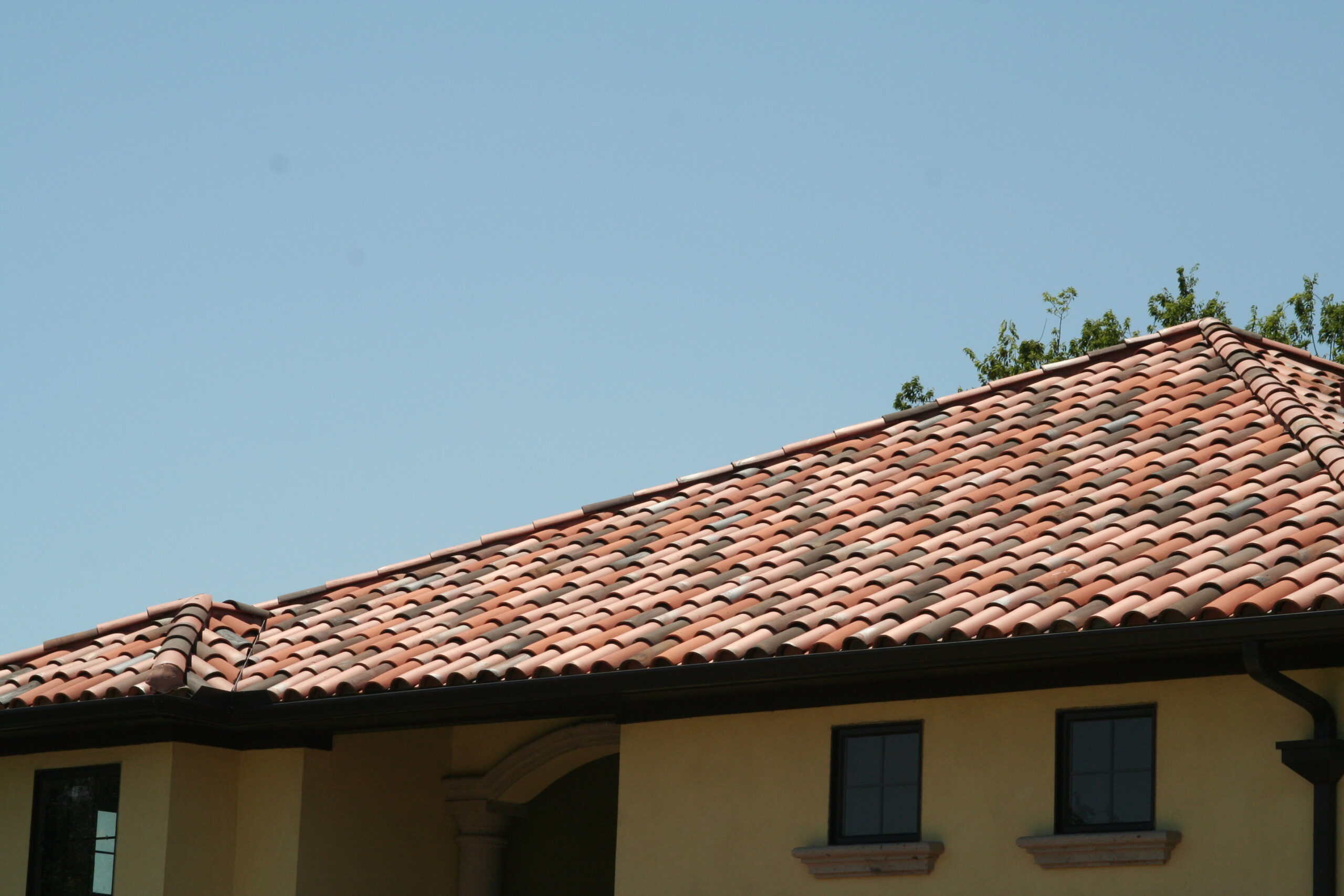 Aged clay and sun-washed tones give this roof an authentic Old World look. Castilla Mission Tiles in Kiln Flash Blend