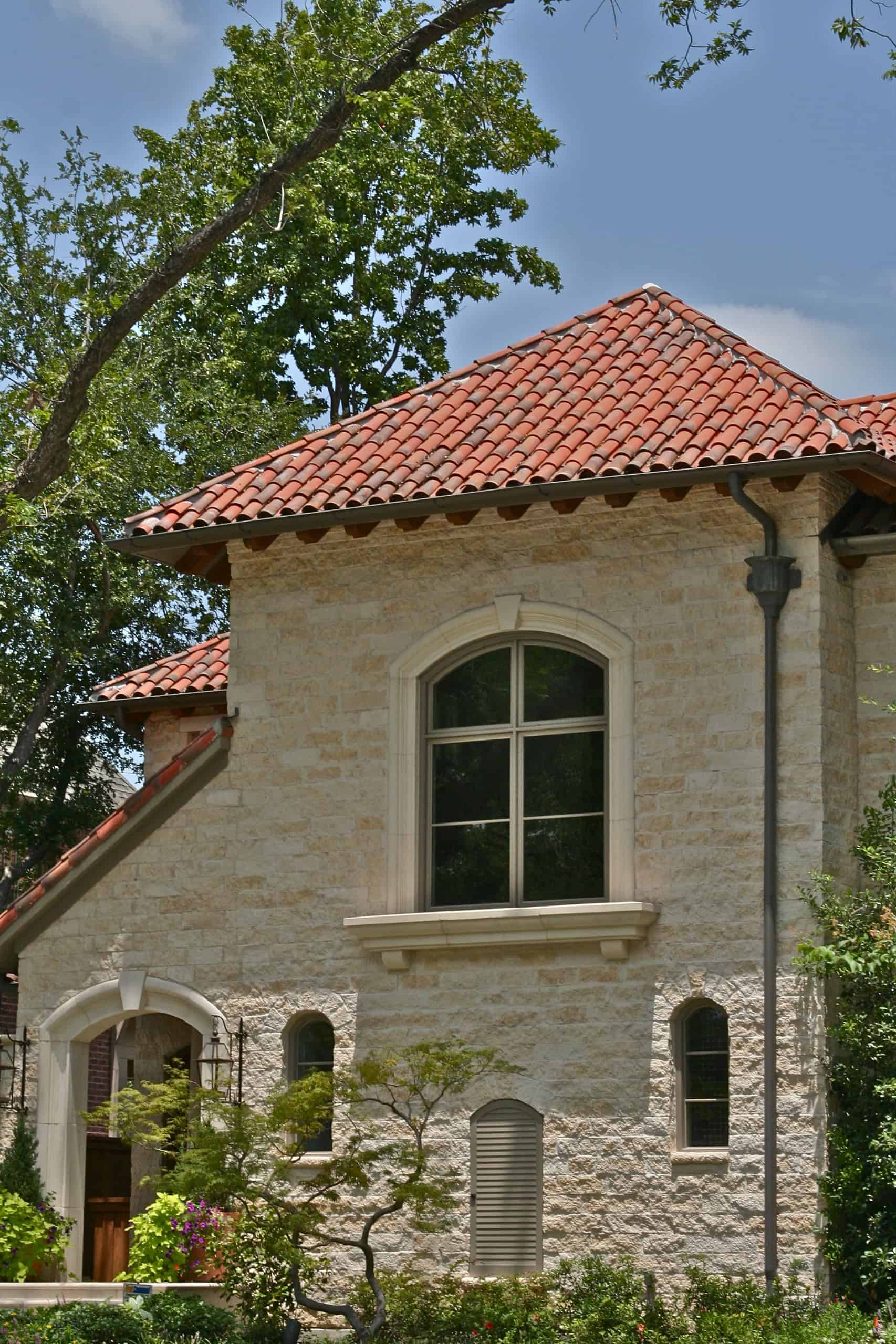 Earthy tones and subtle aging blend beautifully with the home’s stone details.