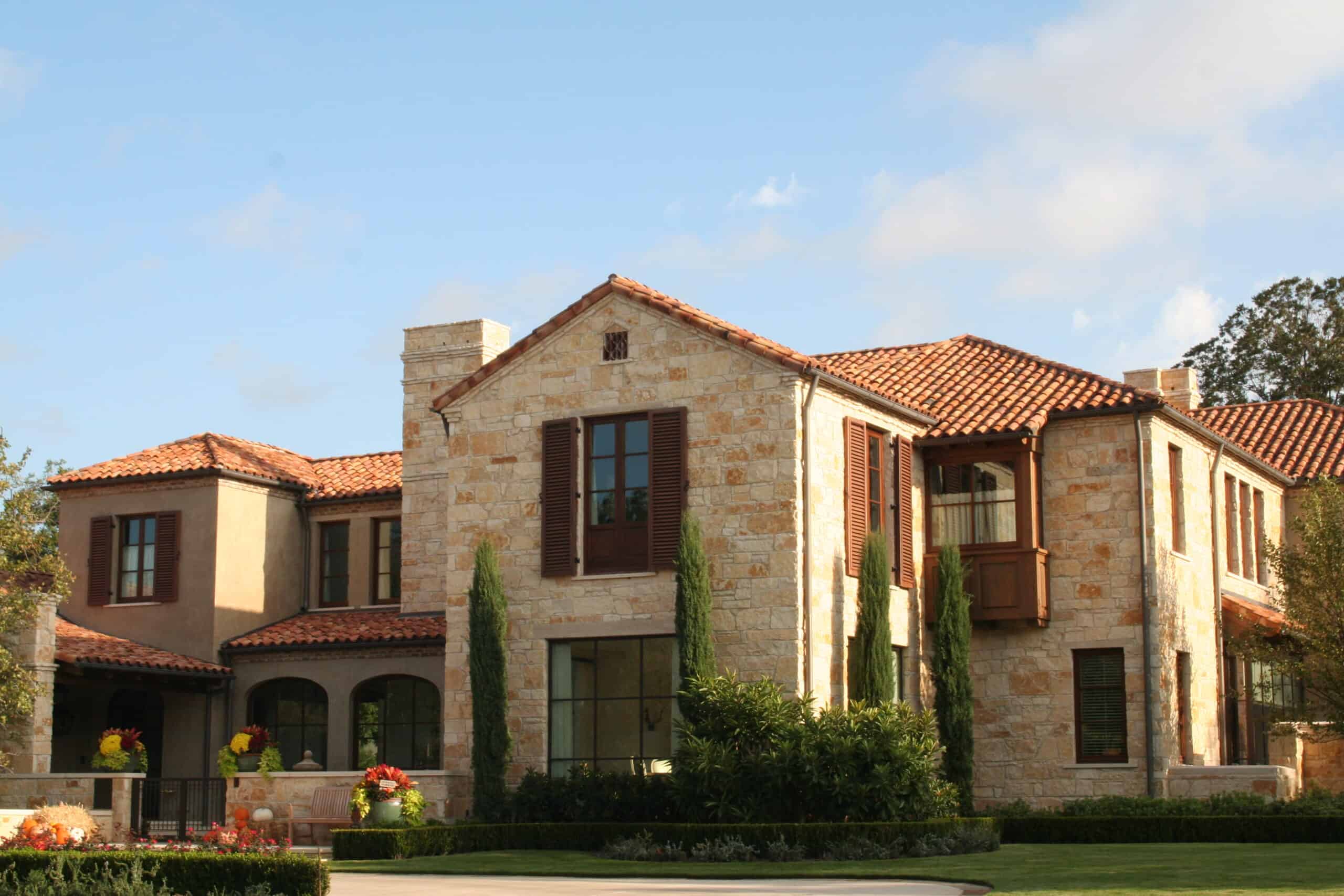 A weathered roof that doesn't just protect, but elevates the entire home with character and history. Castilla Mission style clay tile in Limestone Kiln Flash