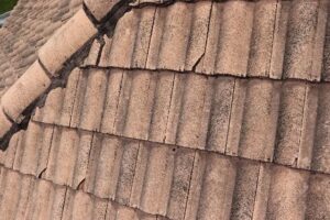 cracked roof tiles in need of replacement 